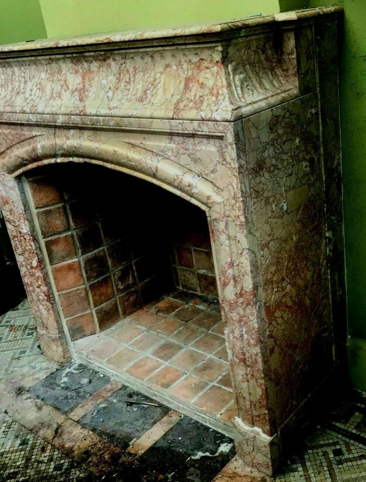 Louis XIV-style fireplace has 19th century veined pink marble hood