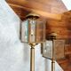 Brass and beveled glass lantern-like wall lamps in brass and beveled glass
