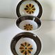 Set of three Italian deep plates from the 1970s, with ochre brown floral decoration.