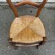Vintage solid oak chair with rush seat, Louis Philippe style from the 20th century.