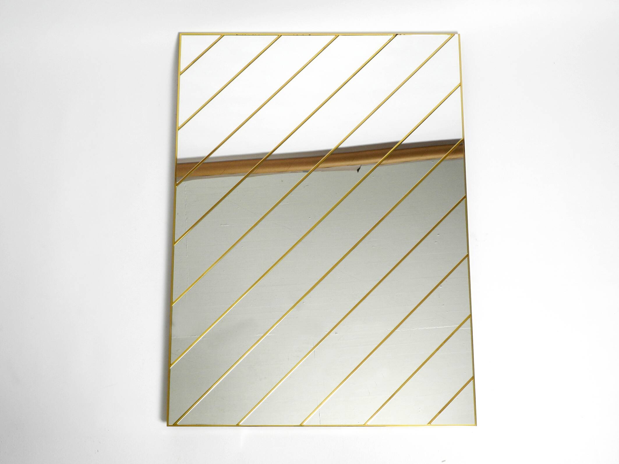 Large, exceptional 1970s brass wall mirror with diagonal mirror strips