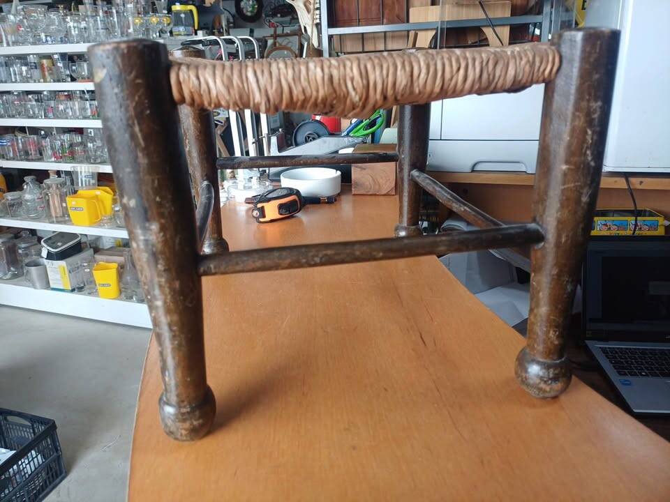 Small rustic vintage stool in wood and straw.