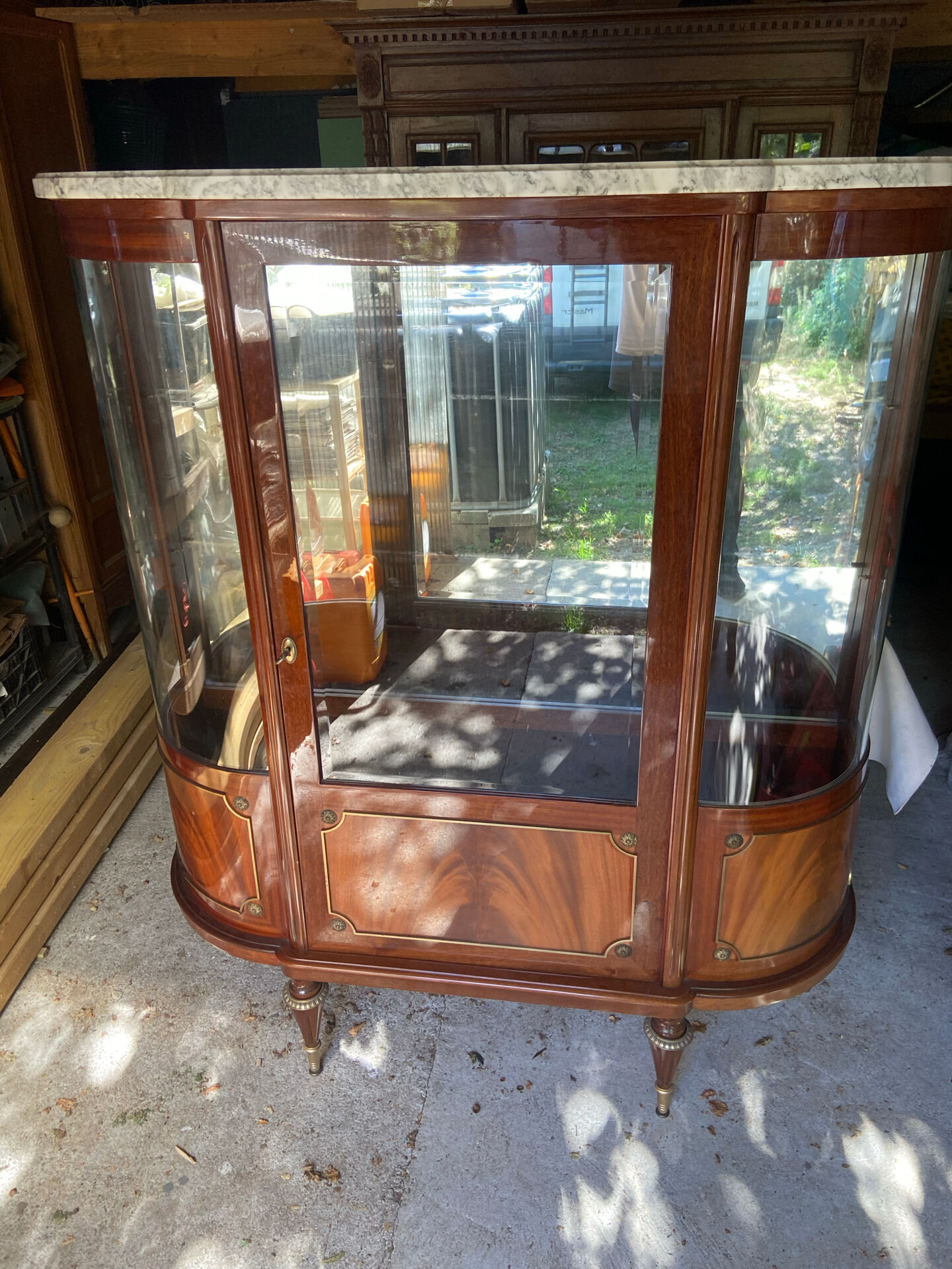 Large Louis XVI style display cabinet in wood and marble.