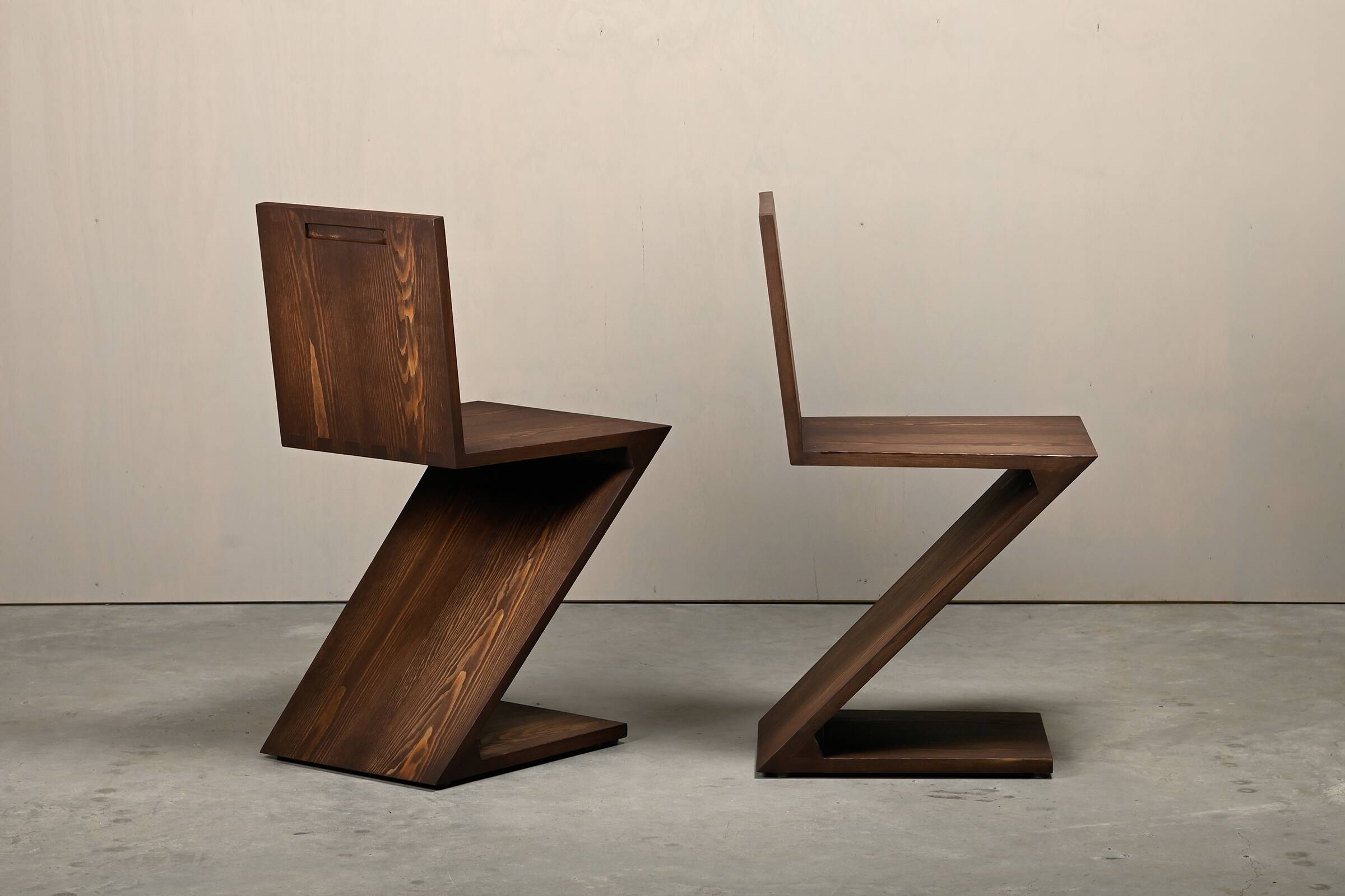 Gerrit Rietveld Zig Zag Chair is dark brown stained wood