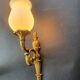 Three large vintage torch wall sconces.