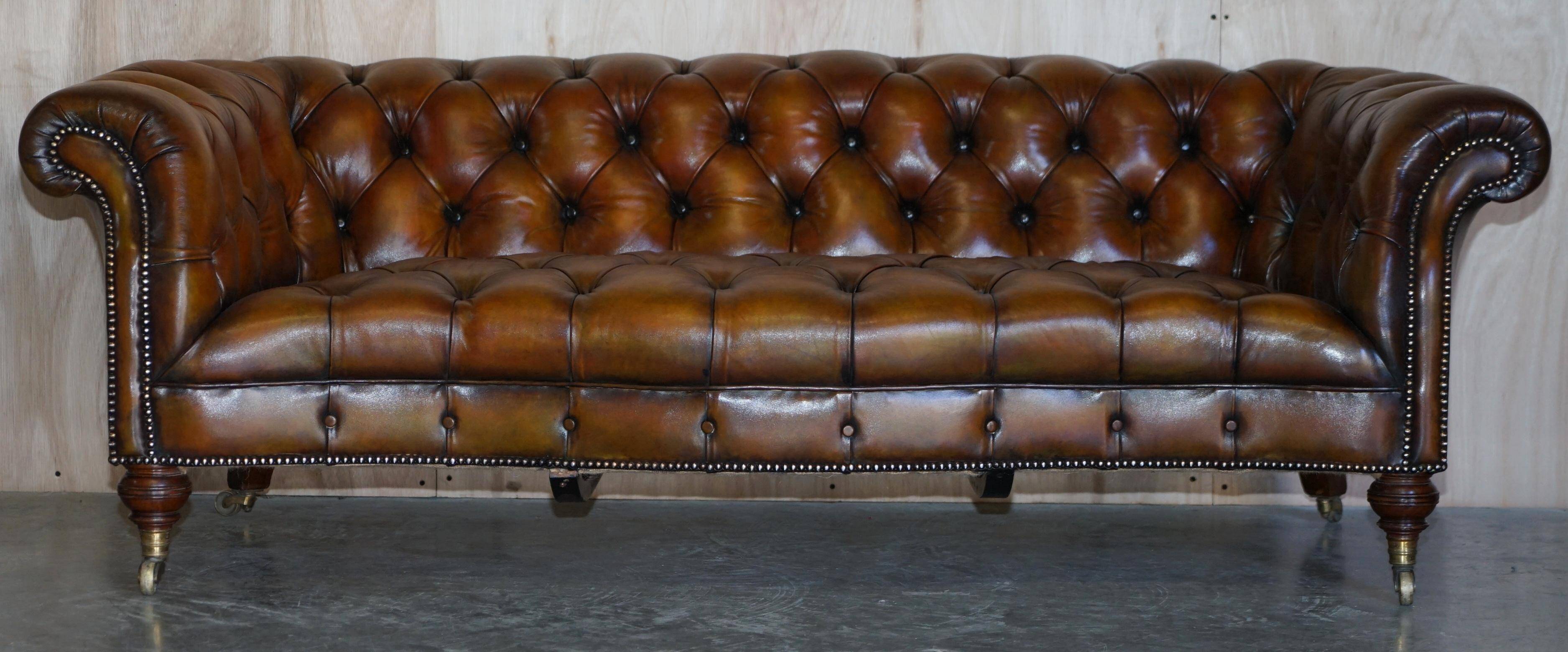 Pair of leather Chesterfield sofas by Howard & Sons
