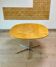 Dining table with a star-shaped six-legged base by Arne Jacobsen for Fritz Hansen.
