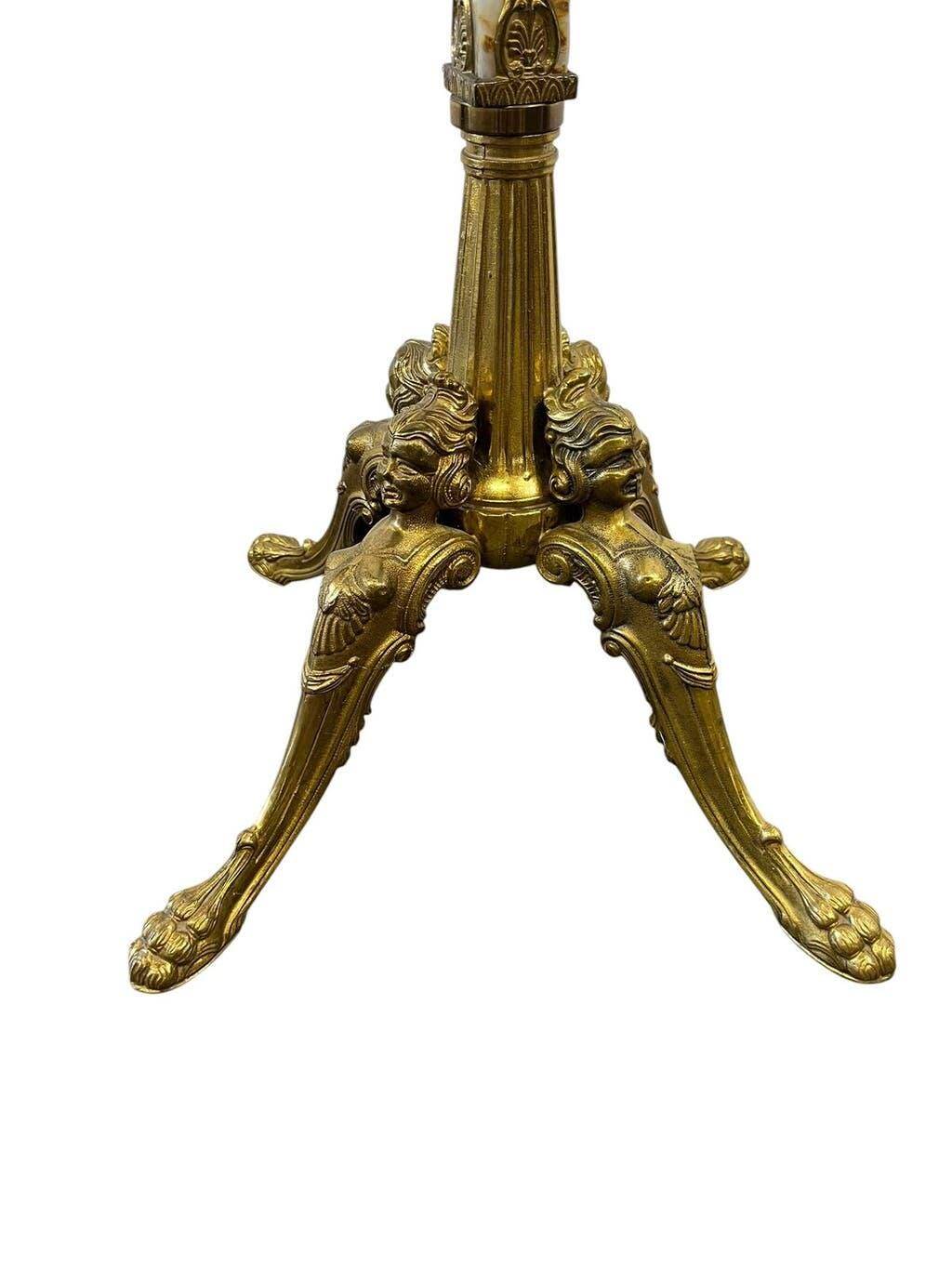 Vintage floor coat rack in gilded brass with onyx details.