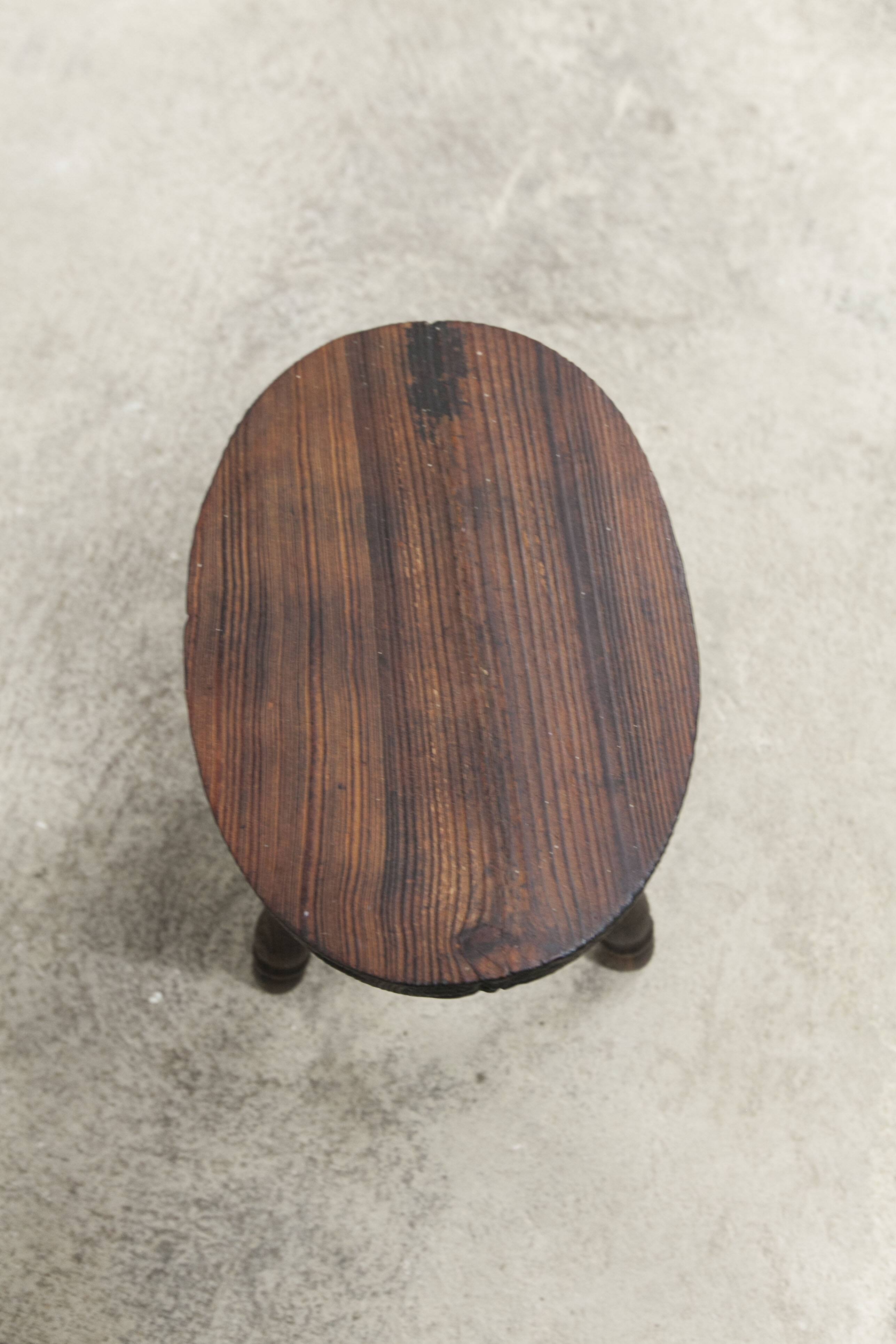 Low brutalist solid wood stool 1950