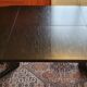 Baumann-type table with 4/8-person extensions.