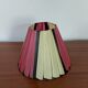 Pleated red and pale yellow plastic conical lampshade from the 1960s.