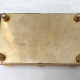 Empty pocket in gold metal and pink stones