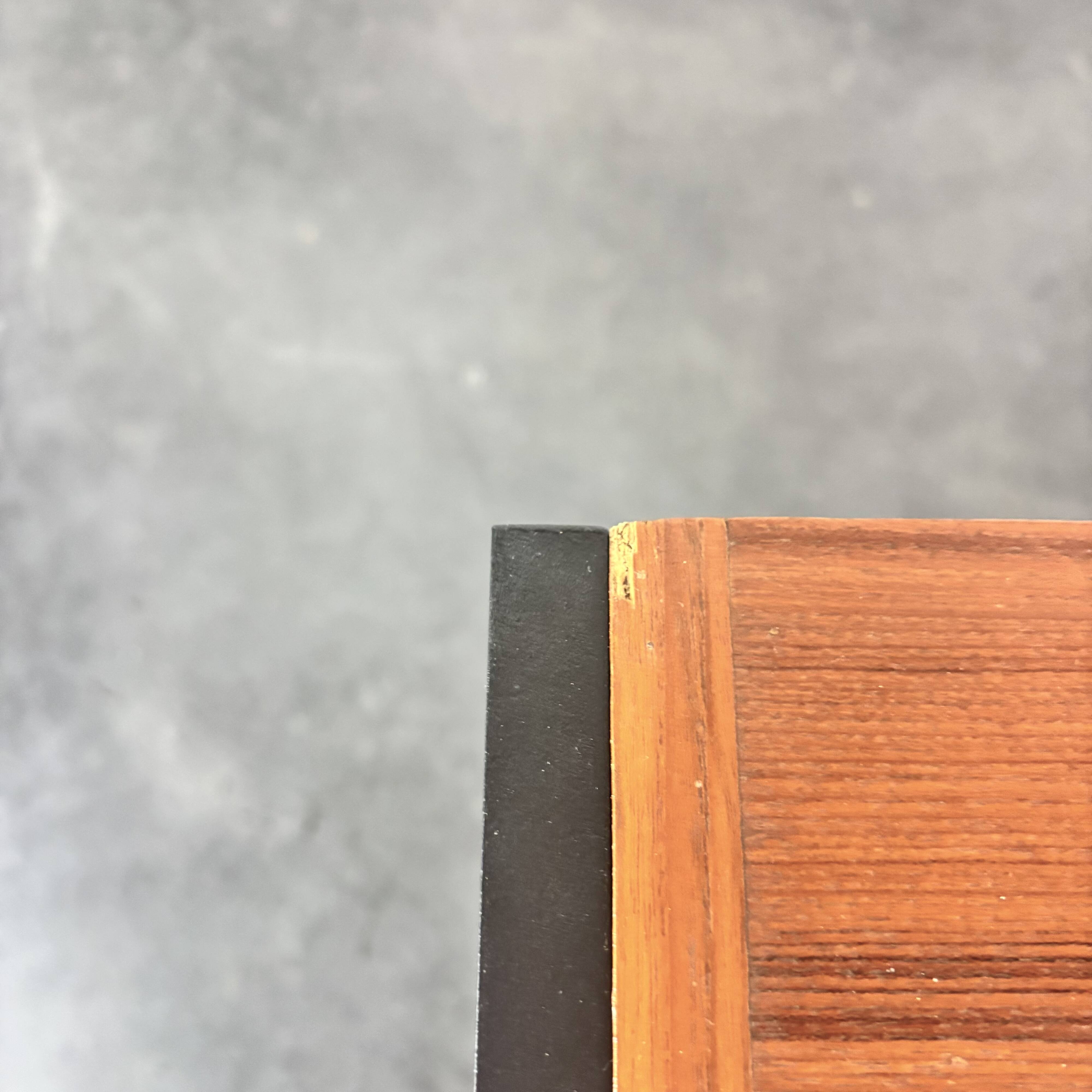 Modernist lowboard, faux leather, wood and stainless steel, 1960.