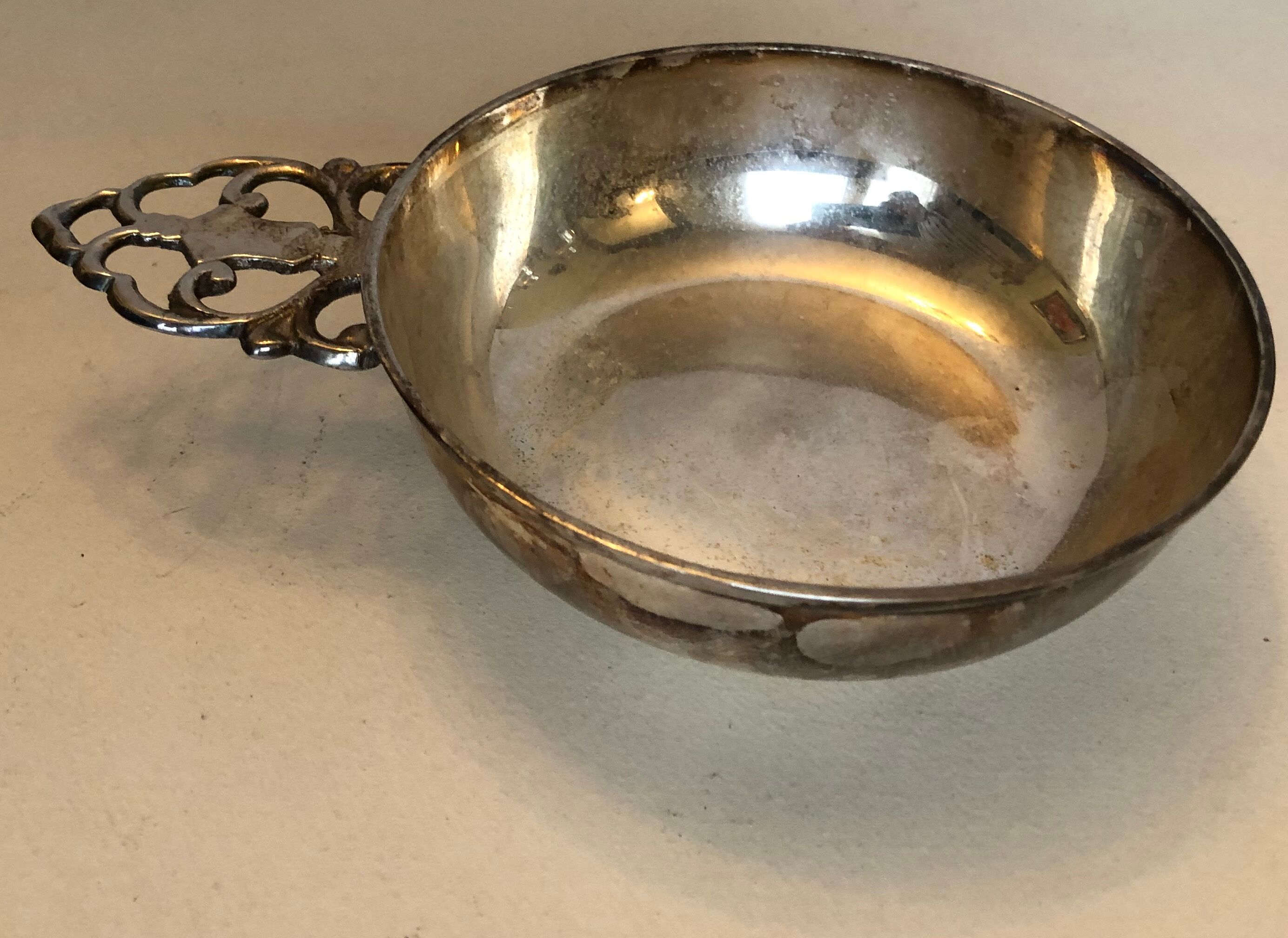 Silver metal tastevin