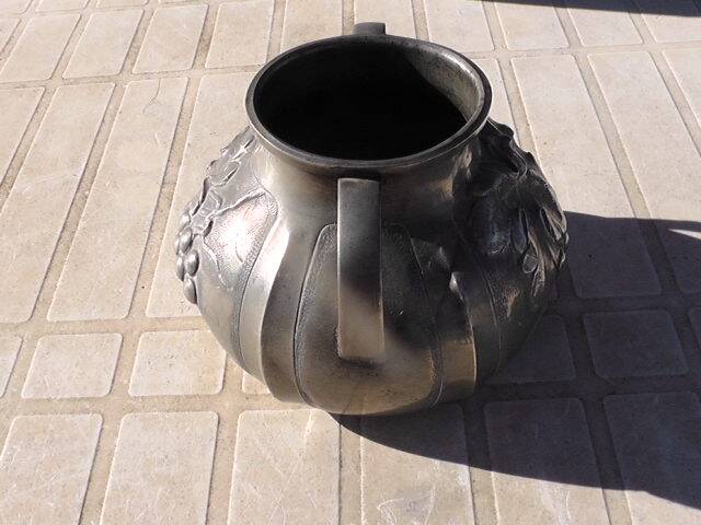 Pewter vase with vine decoration, 1930