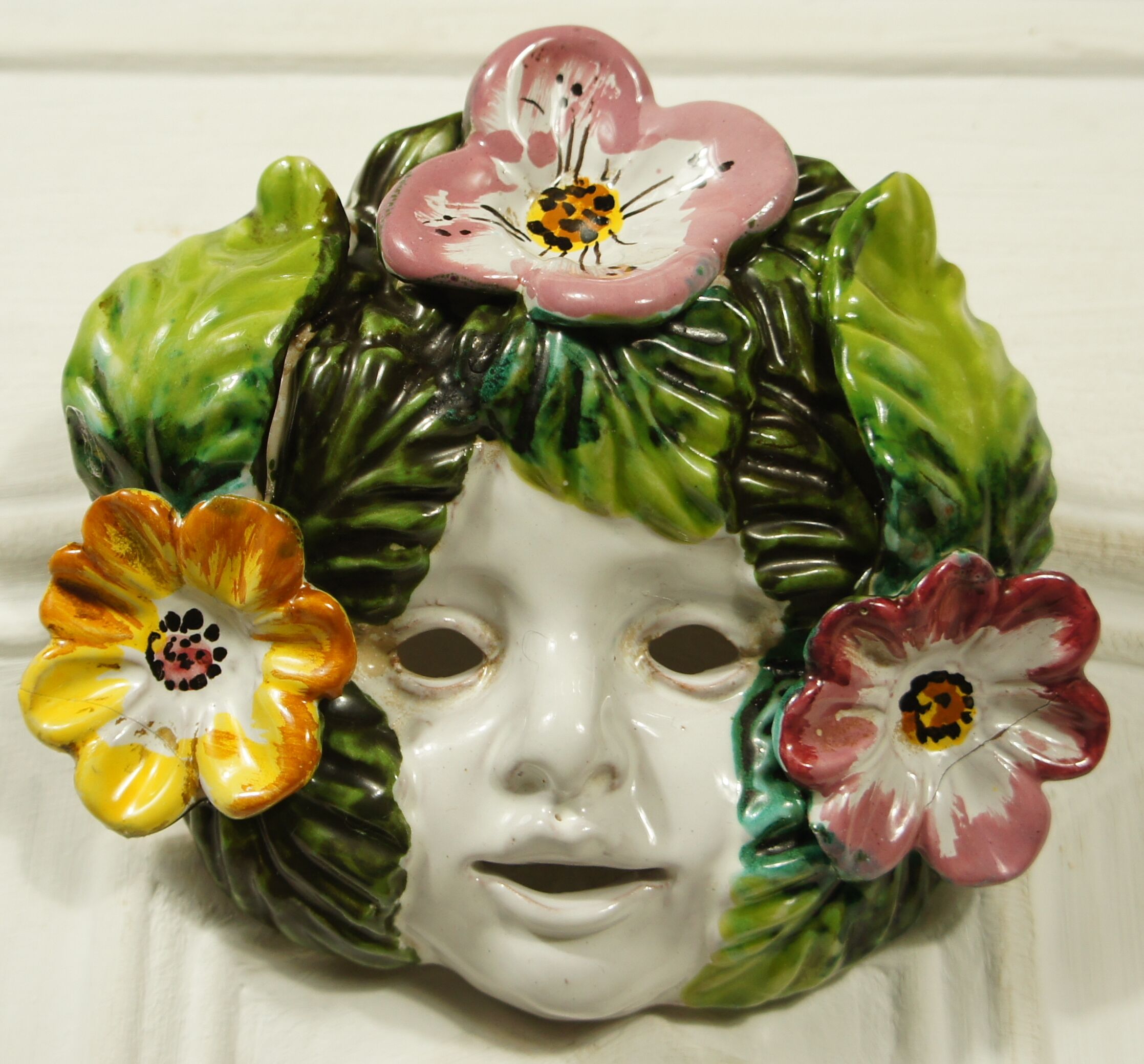 Ceramic mural hoot cherub