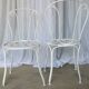 Pair of antique garden chairs, wrought iron, white paint.