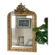 Golden fireplace mirror with pediment
