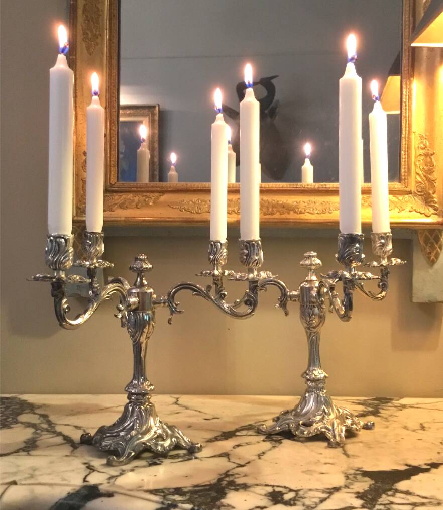 Pair of three-armed silver-plated metal candelabras