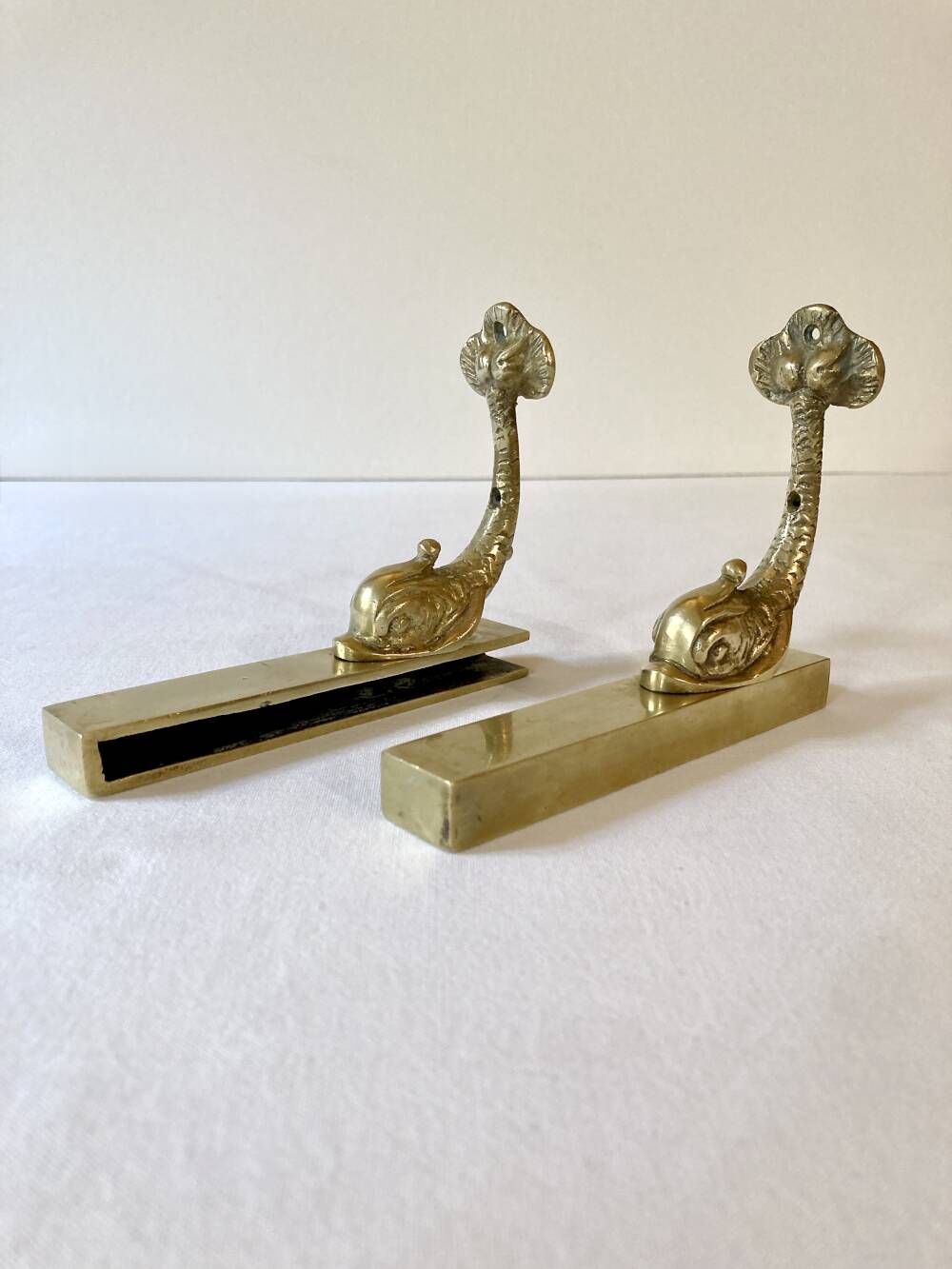 Brass wall supports for bathroom shelf, circa 1950.