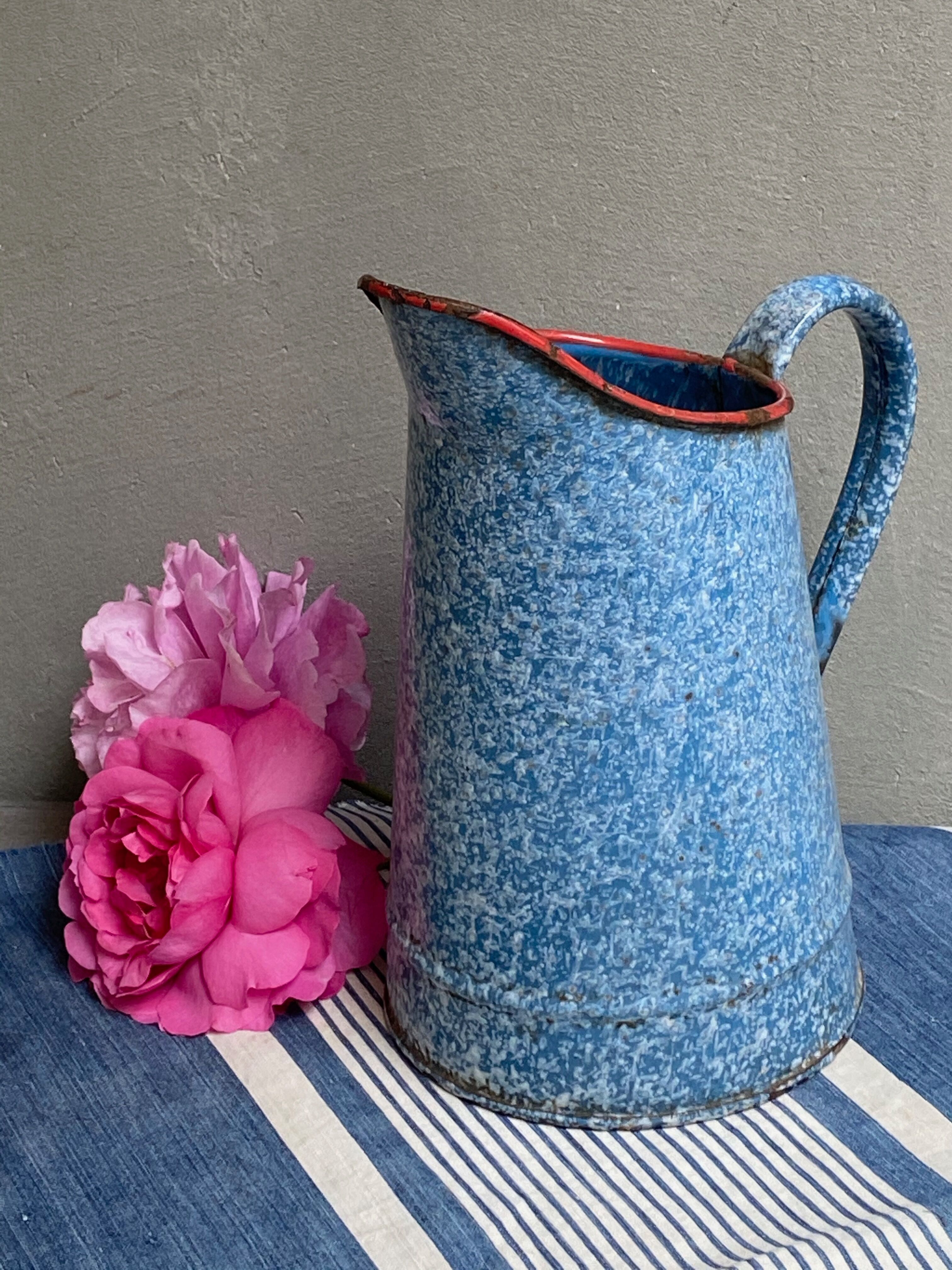 Old enamelled pitcher