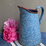 Old enamelled pitcher
