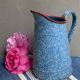 Old enamelled pitcher
