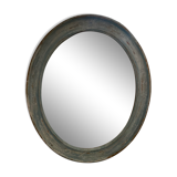 Patinated oval mirror