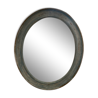 Patinated oval mirror