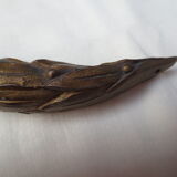 old bronze curved pediment