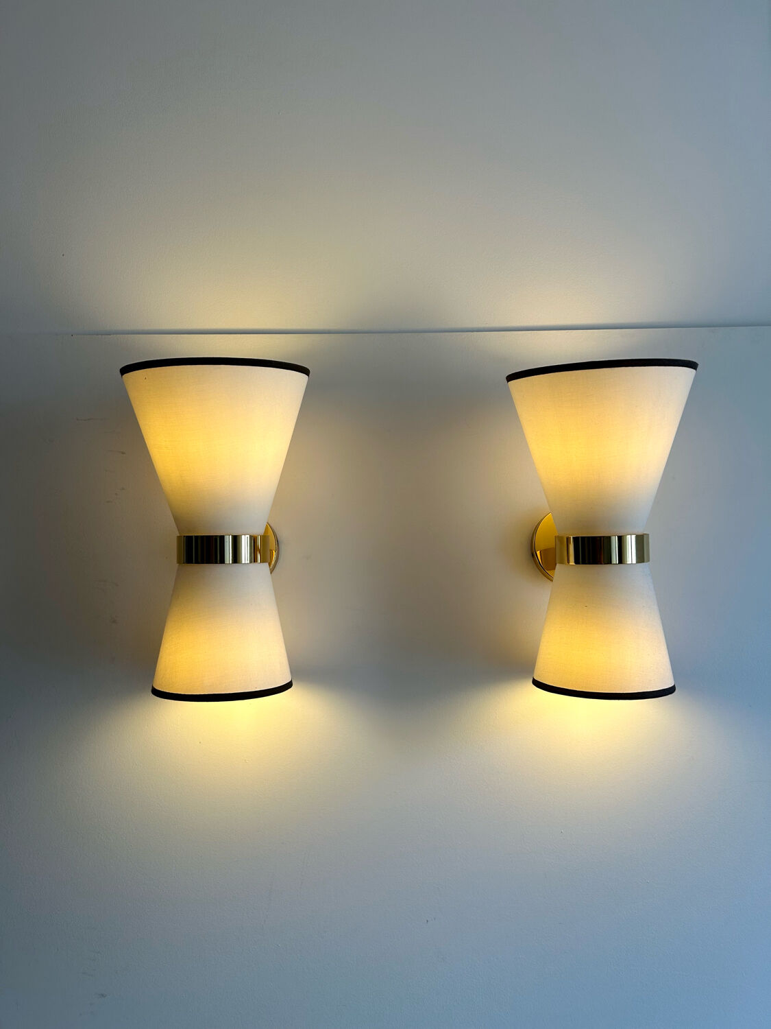 Pair of vintage wall lamps, brass and unbleached fabric, Italy 1980