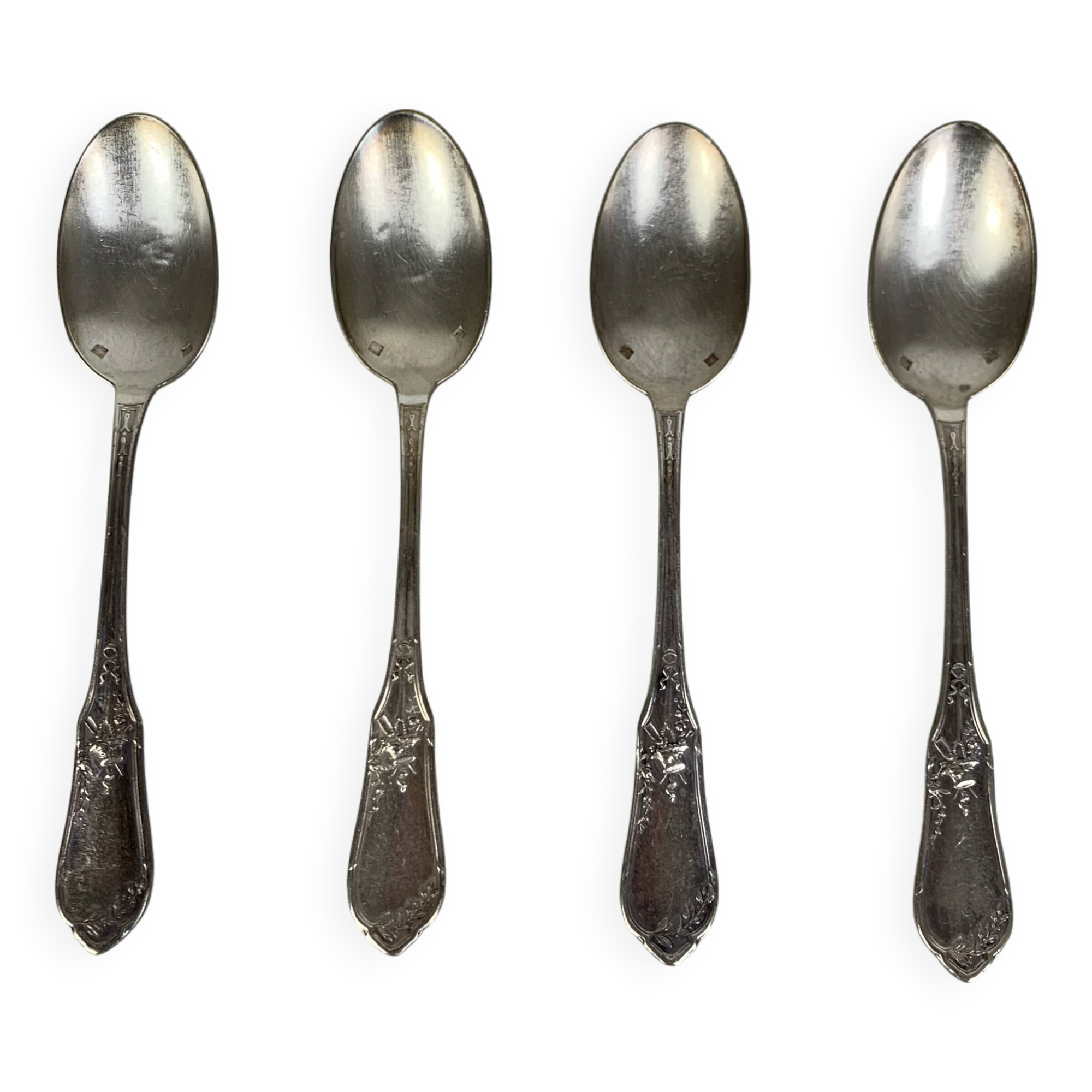 4 small silver metal spoons