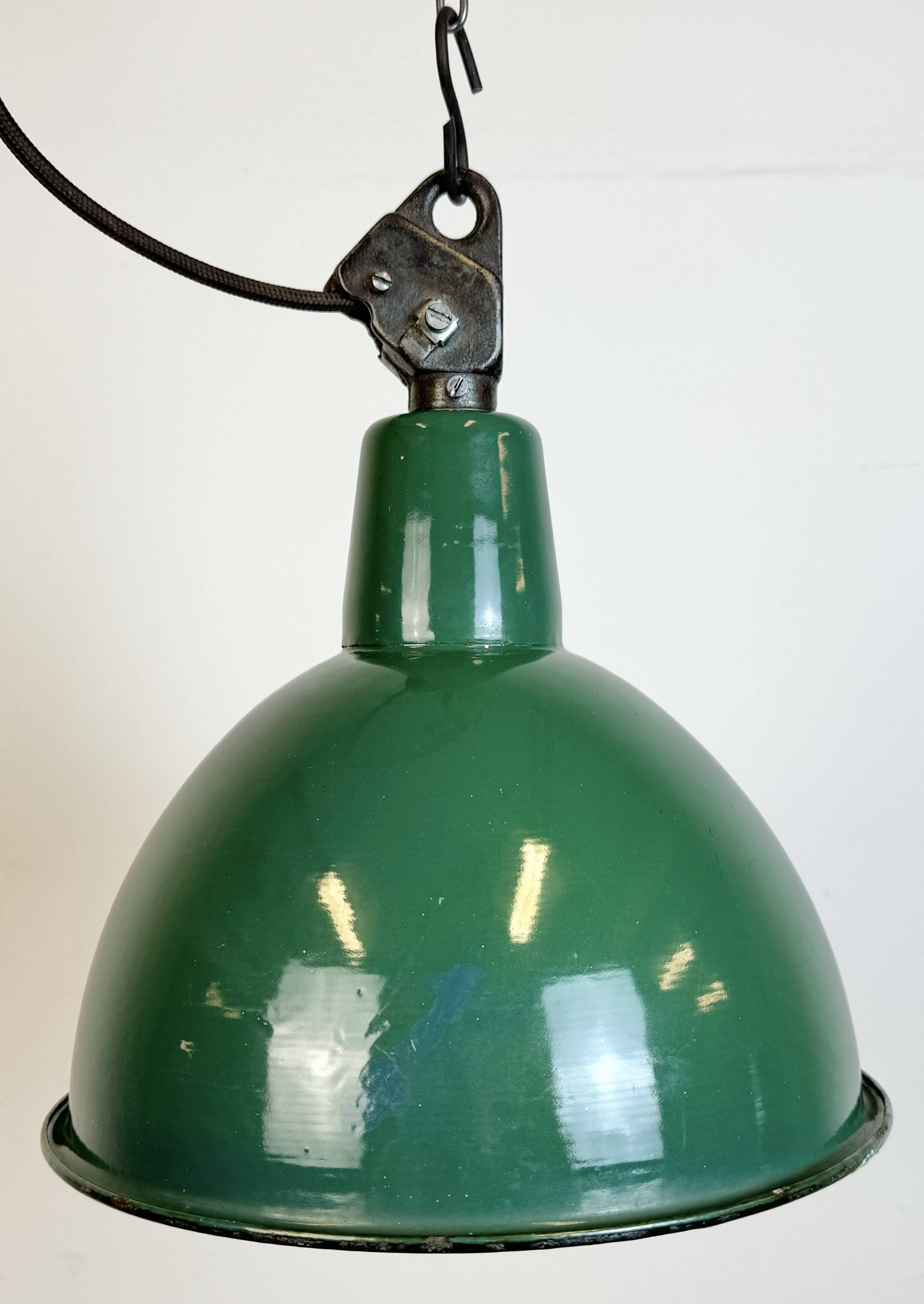 Industrial green enamel factory lamp with cast iron top, 1960s