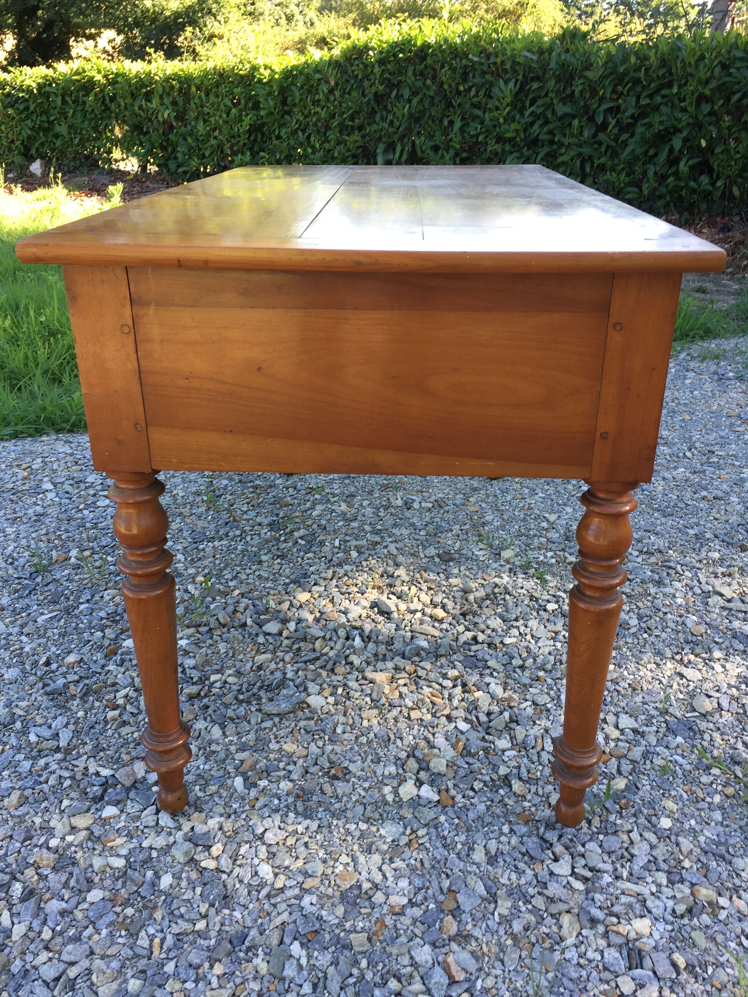 Old farmhouse table louis Philippe style in solid cherry with turned feet.