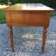 Old farmhouse table louis Philippe style in solid cherry with turned feet.