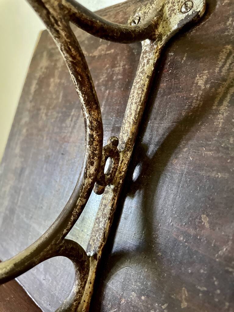 Patinated wood and metal coat rack from the 1950s.