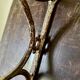 Patinated wood and metal coat rack from the 1950s.