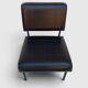Modernist armchair in black faux leather and metal – 1960s