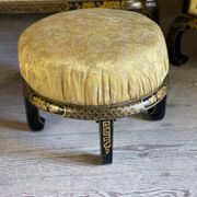 A set of two armchairs, a sofa and two poufs in lacquered wood with gilded chinoiserie decoration.