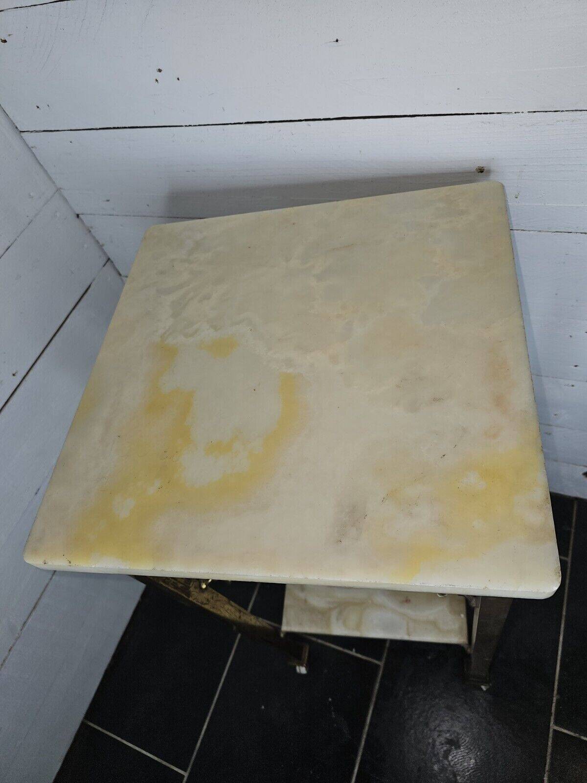 Bedside table in patinated iron, brass and marble tops