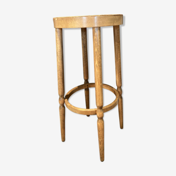 High curved wooden stool