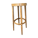 High curved wooden stool