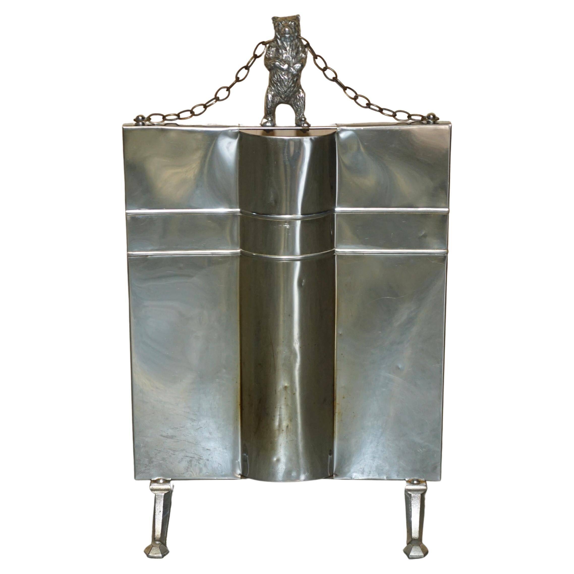 Art Deco fire screen from around 1920 in polished chrome with a bear.