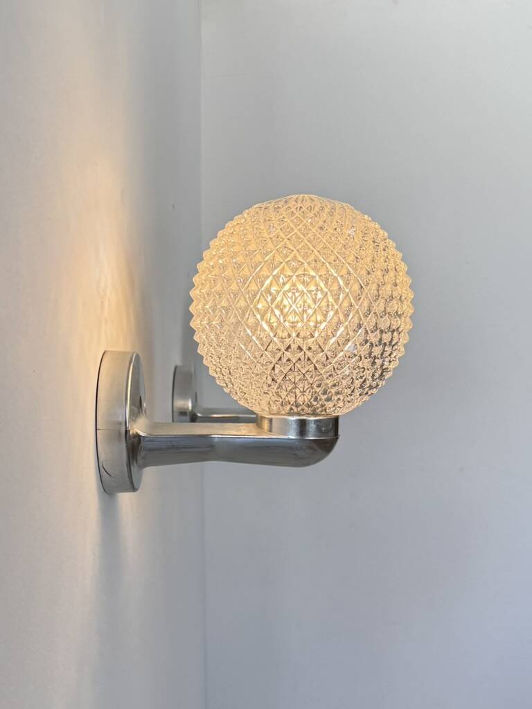 Pair of vintage wall lights in chrome metal and pressed moulded glass, France, 70s.