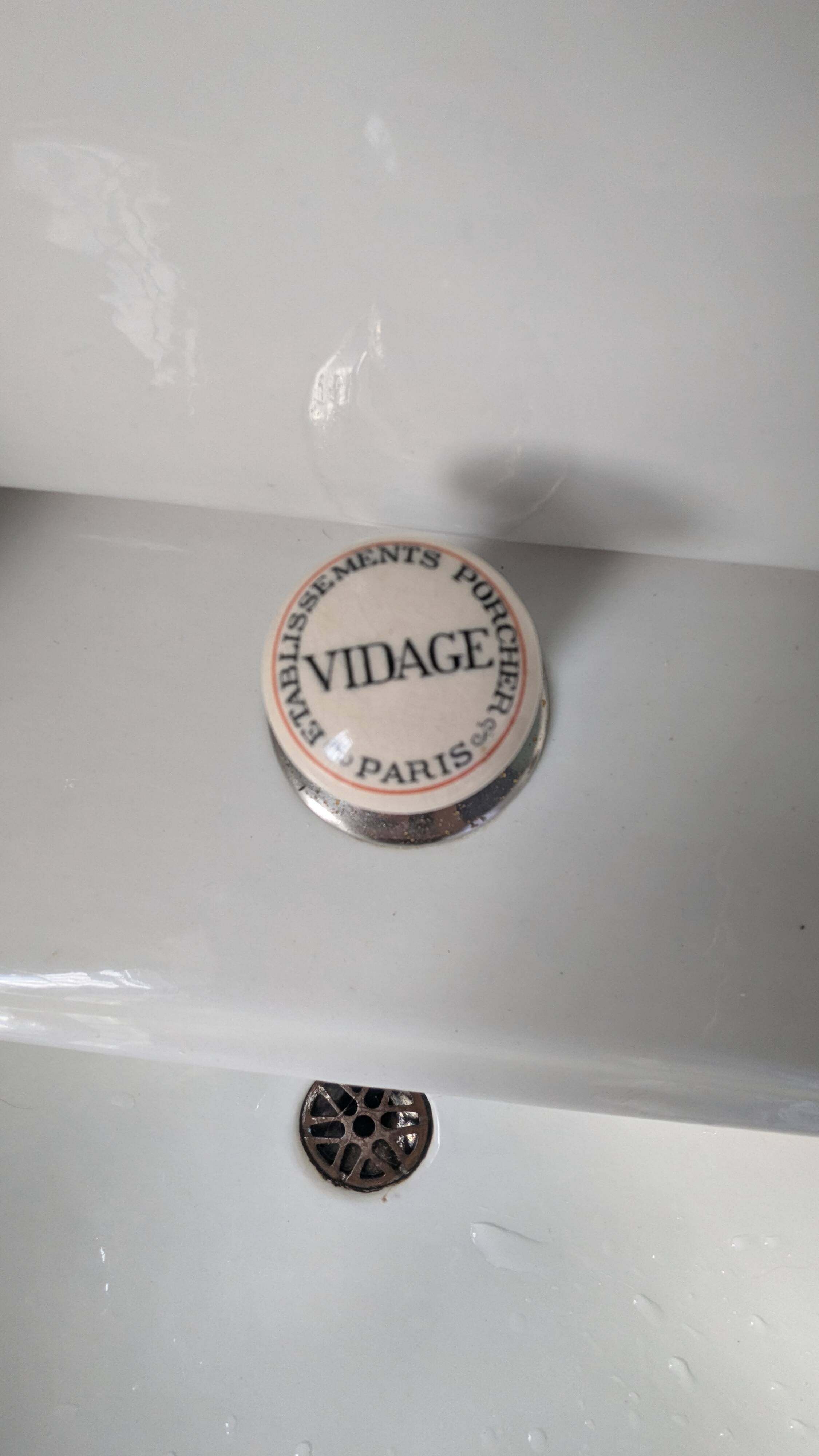 Set of a sink and its retro ceramic splashback.