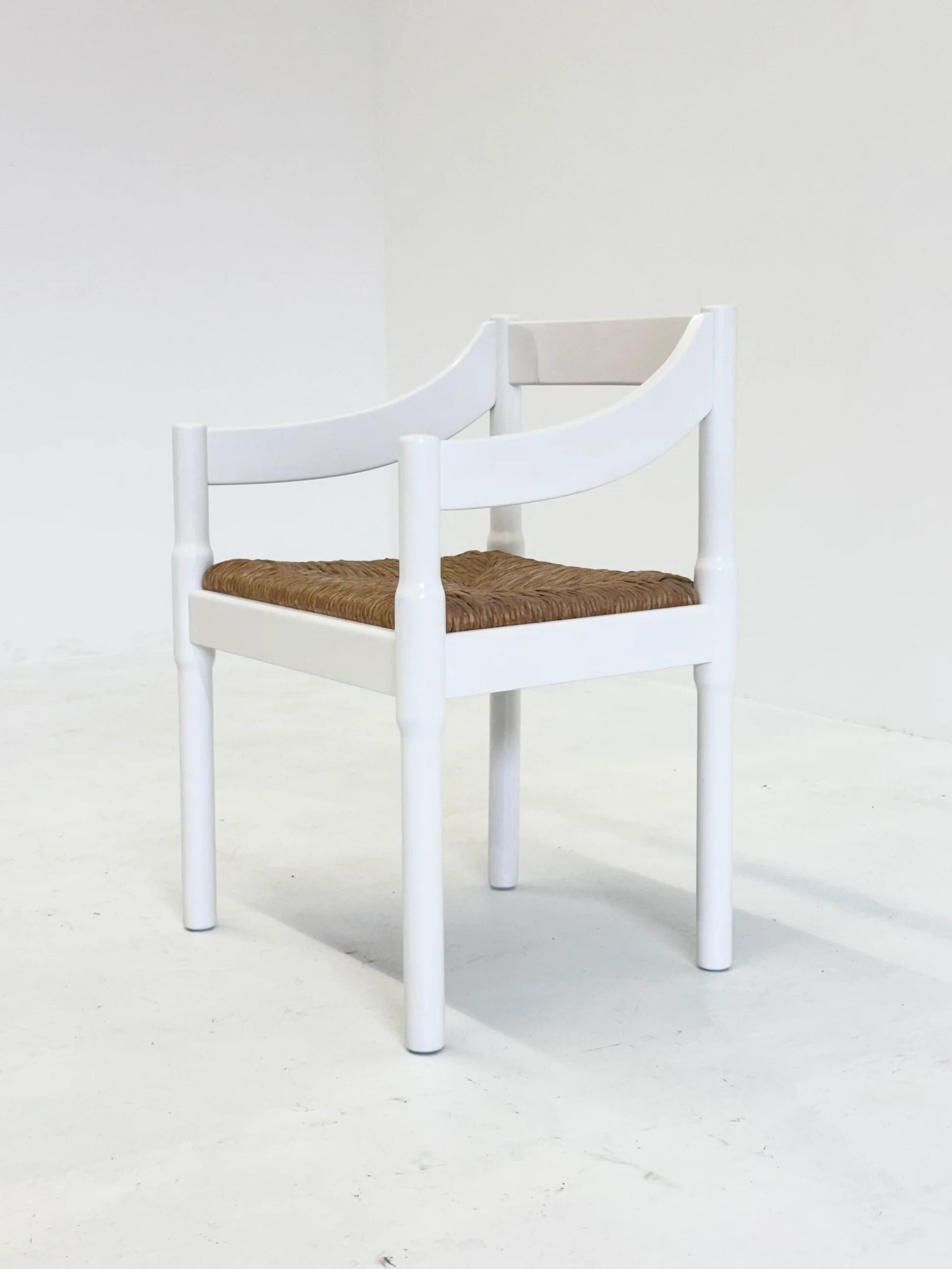 Set of two Carimate chairs by Vico Magistretti in white
