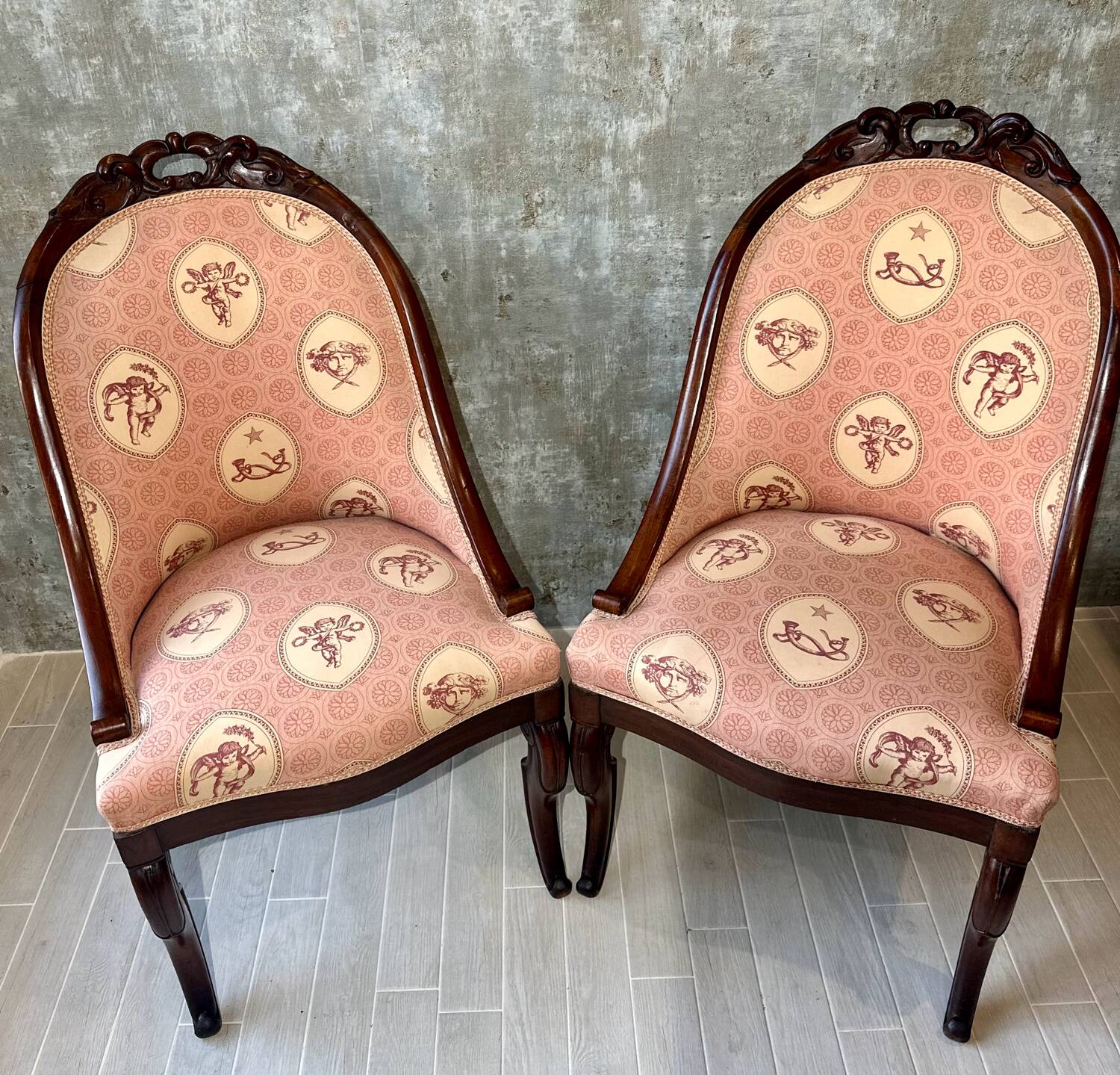 Pair of carved solid mahogany gondolas from the 19th century