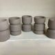 Five matte gray candle holders
