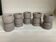 Five matte gray candle holders