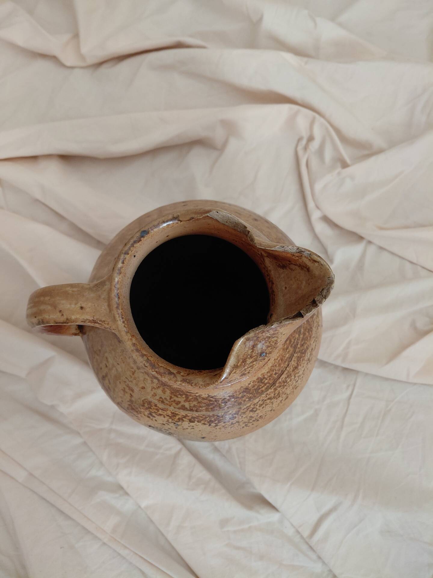 Old farm jug in glazed stoneware